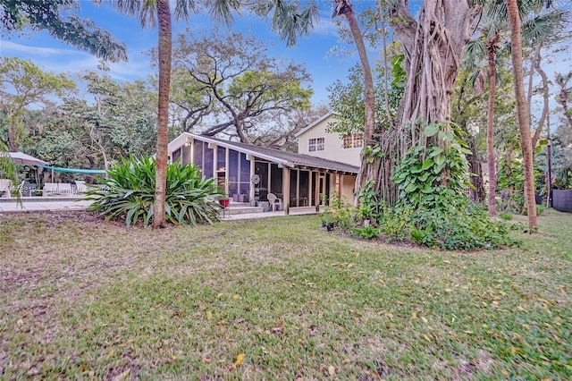 view of yard featuring a sunroom