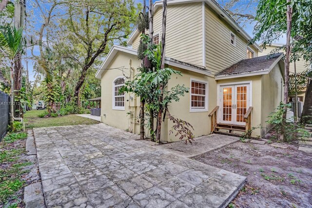 view of patio featuring french doors, a balcony, a grill, and outdoor lounge area