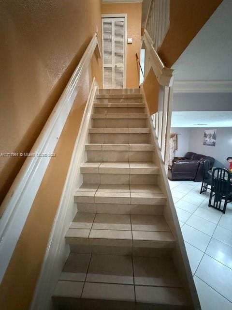 stairs with tile patterned floors