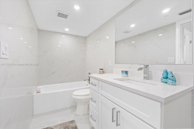 full bathroom with vanity, toilet, bathing tub / shower combination, and tile walls