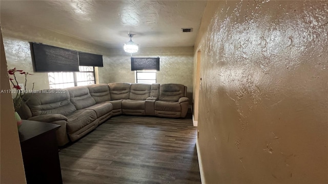 living room featuring dark wood-type flooring