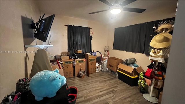 bedroom featuring hardwood / wood-style flooring and ceiling fan