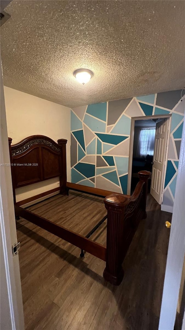 bedroom with wood-type flooring