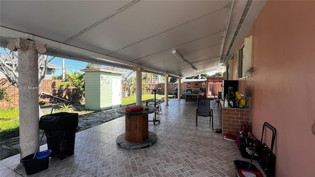 view of patio / terrace with a storage unit