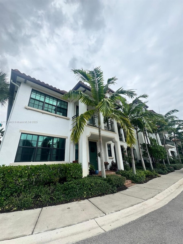 view of front of property with a balcony