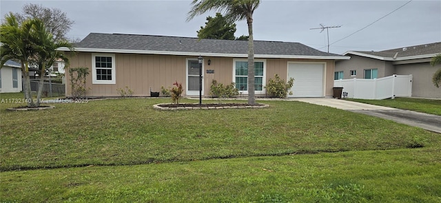 ranch-style home with a garage and a front lawn