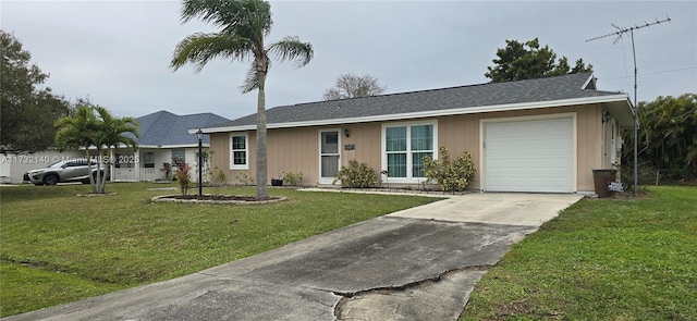 single story home with a garage and a front lawn