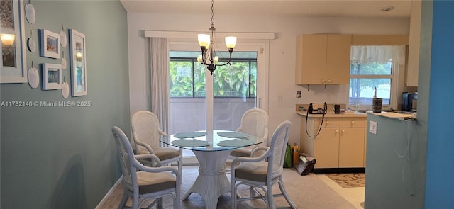 dining room featuring plenty of natural light and a chandelier