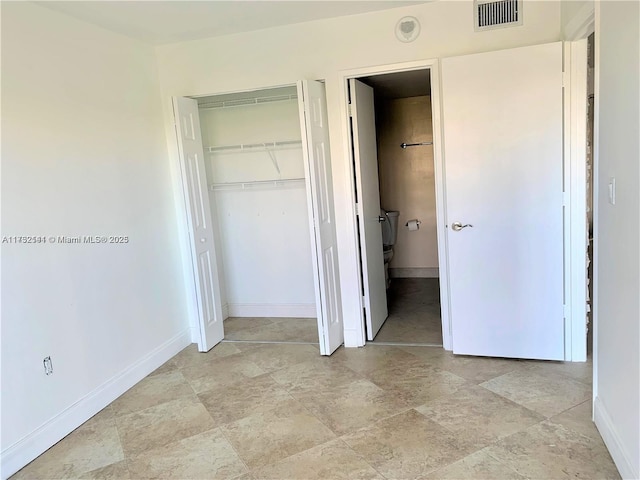 unfurnished bedroom featuring a closet