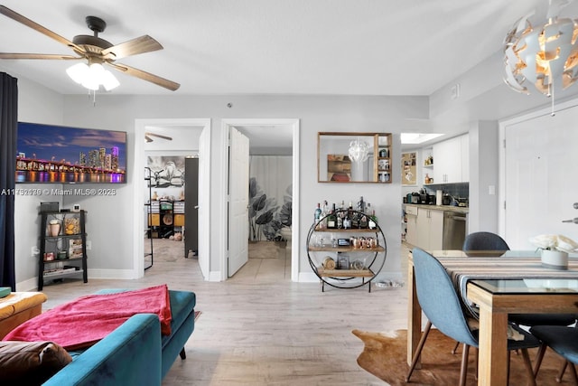 dining room featuring light hardwood / wood-style floors and ceiling fan