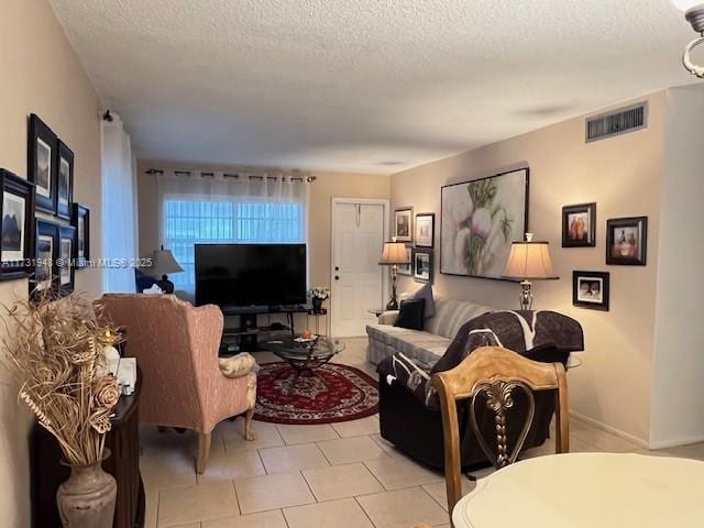 living room with a textured ceiling