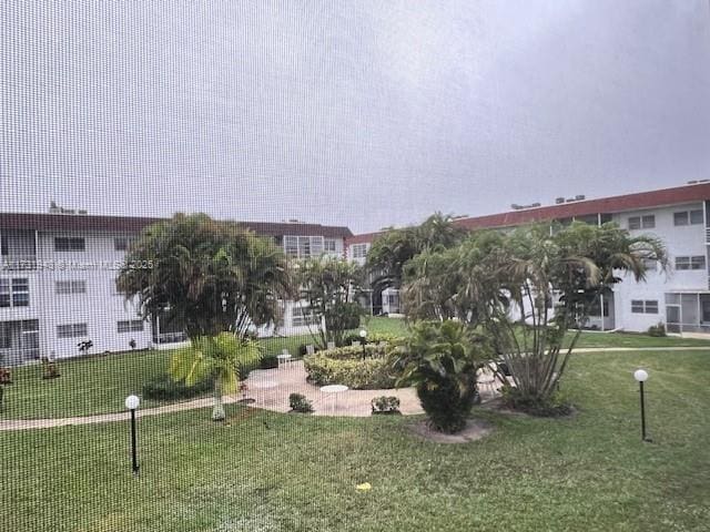 view of home's community featuring a lawn