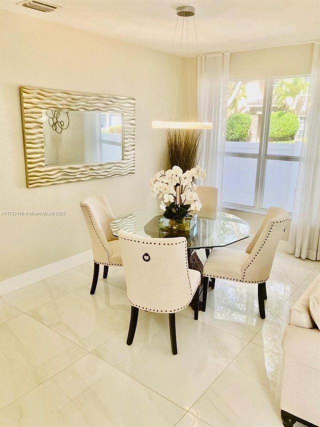 dining room with tile patterned flooring