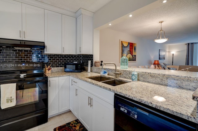 kitchen with sink, tasteful backsplash, black appliances, light tile patterned floors, and white cabinets