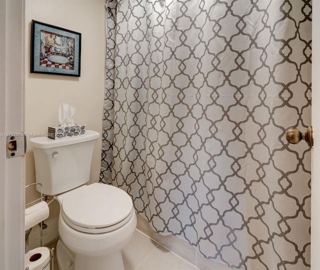 bathroom with tile patterned floors and toilet