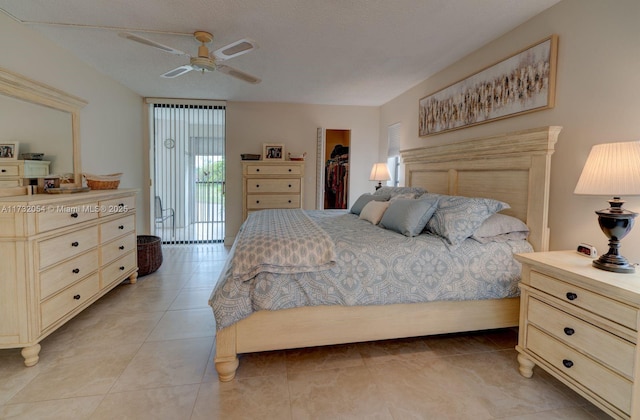 bedroom featuring a textured ceiling, light tile patterned floors, access to outside, a closet, and ceiling fan