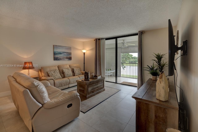 living room featuring expansive windows and a textured ceiling