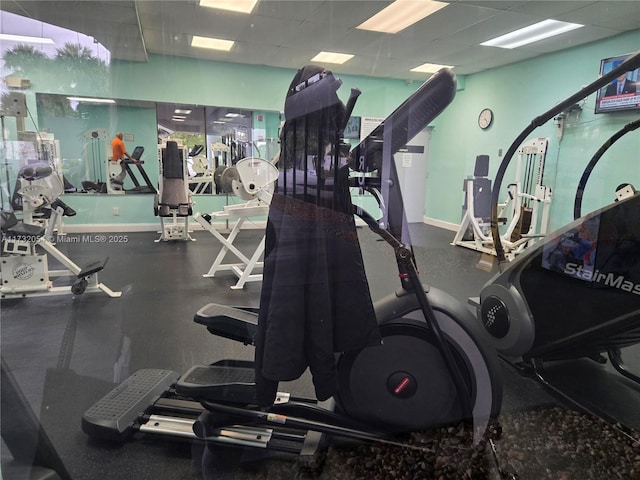 exercise room featuring a paneled ceiling