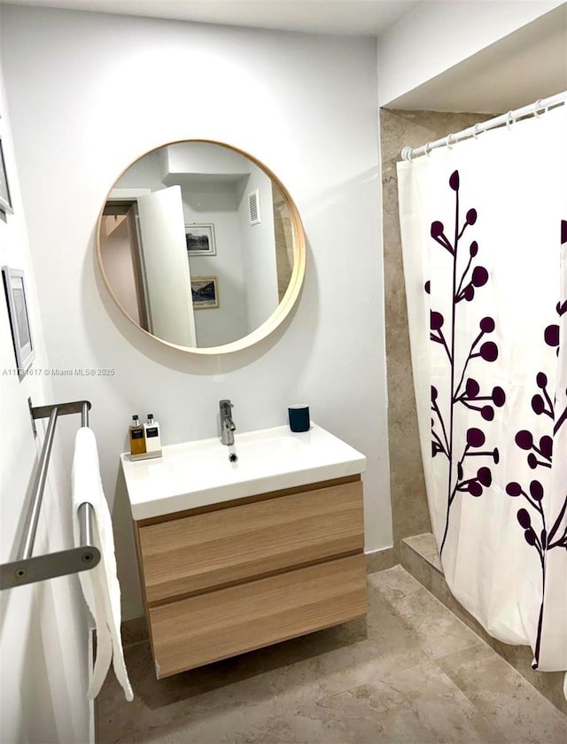 bathroom with vanity and a shower with curtain