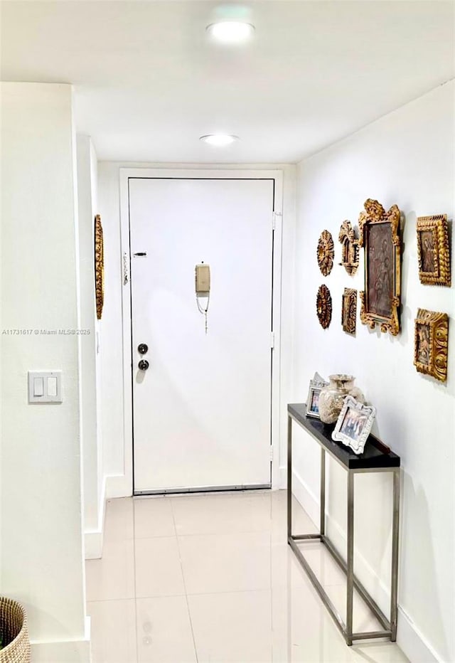 doorway featuring light tile patterned floors