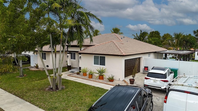 ranch-style home featuring a garage, a tile roof, fence, a front lawn, and stucco siding