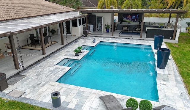 outdoor pool with a patio area and a wooden deck