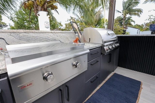 view of patio with exterior kitchen and area for grilling