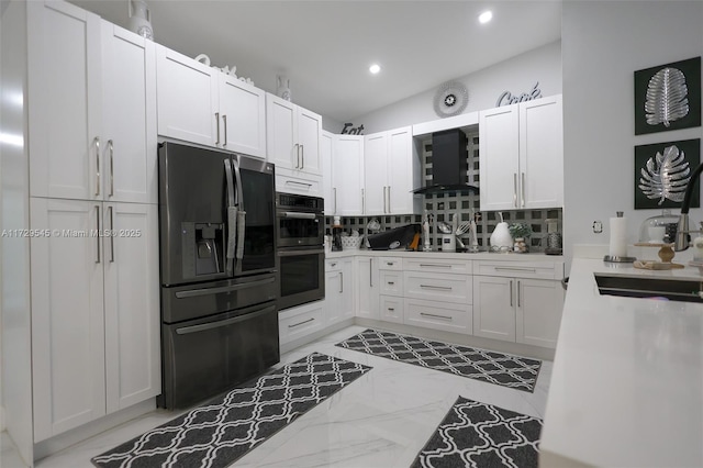 kitchen featuring white cabinets, decorative backsplash, black refrigerator with ice dispenser, stainless steel double oven, and wall chimney range hood