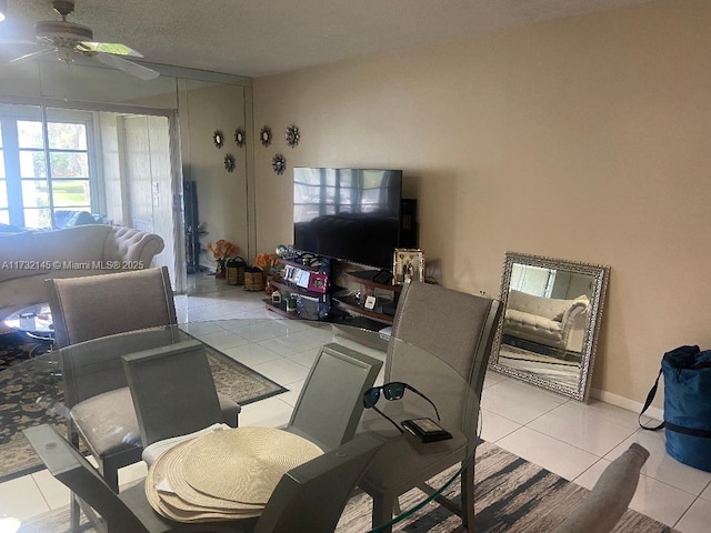 living room with light tile patterned floors and ceiling fan