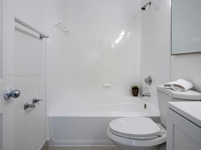 full bathroom with vanity, tiled shower / bath combo, and toilet