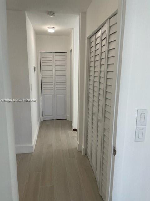 corridor featuring light hardwood / wood-style floors