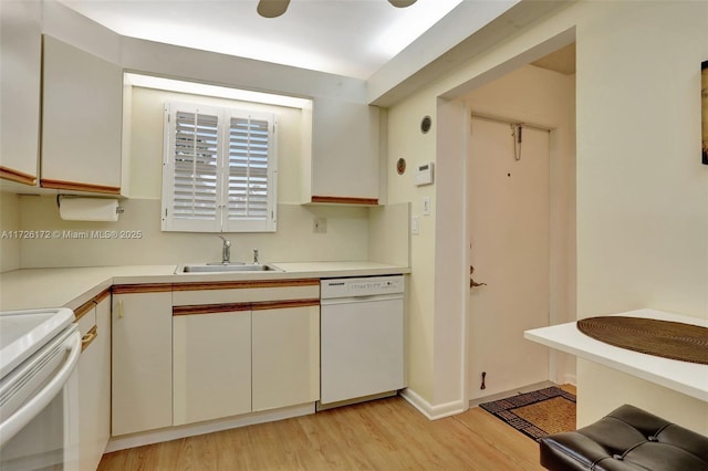 kitchen featuring sink, white appliances, light hardwood / wood-style floors, and white cabinets