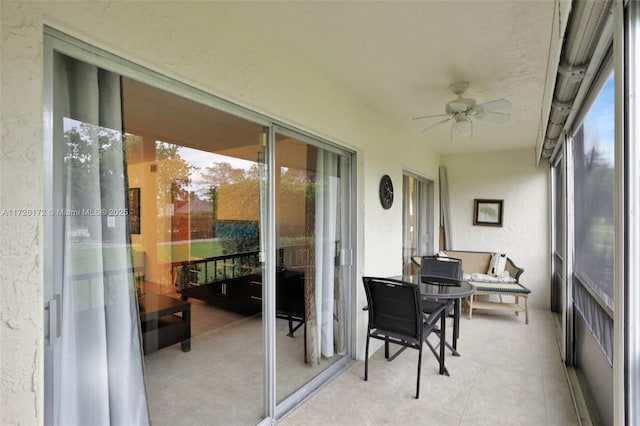 sunroom / solarium with ceiling fan