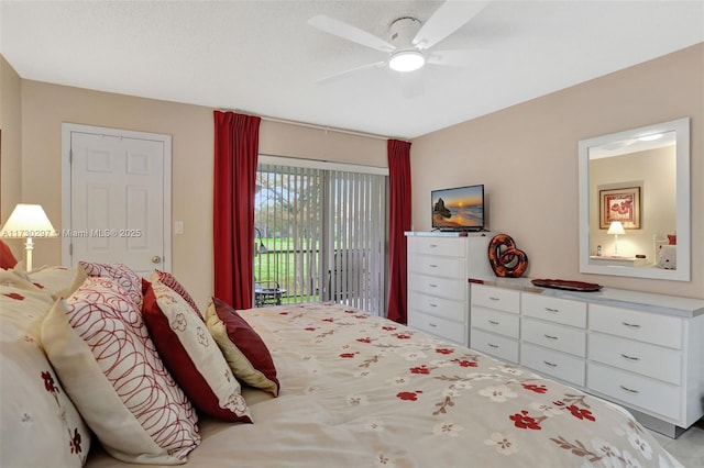 bedroom featuring a textured ceiling, access to exterior, and ceiling fan