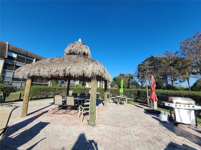 view of community featuring a gazebo and a patio area