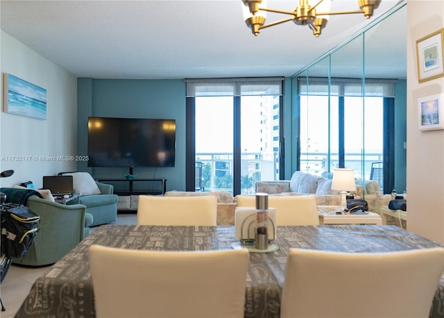 interior space featuring a wall of windows, a chandelier, and a wealth of natural light