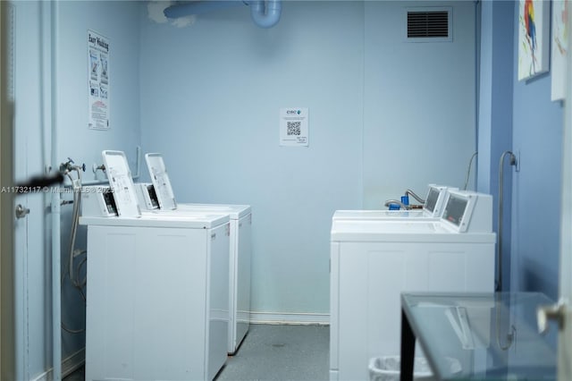 laundry area with washing machine and dryer