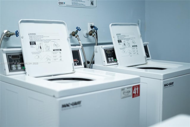 clothes washing area featuring washing machine and clothes dryer