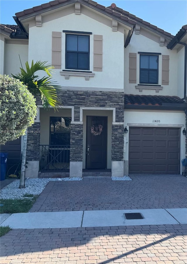 view of front of property with a garage