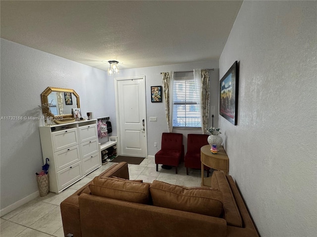 tiled living room with a textured ceiling