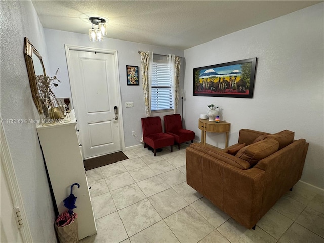 tiled living room with a textured ceiling