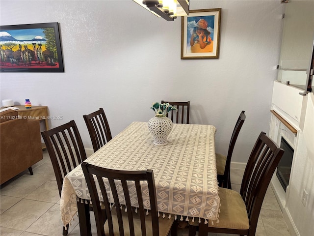 dining area featuring light tile patterned floors