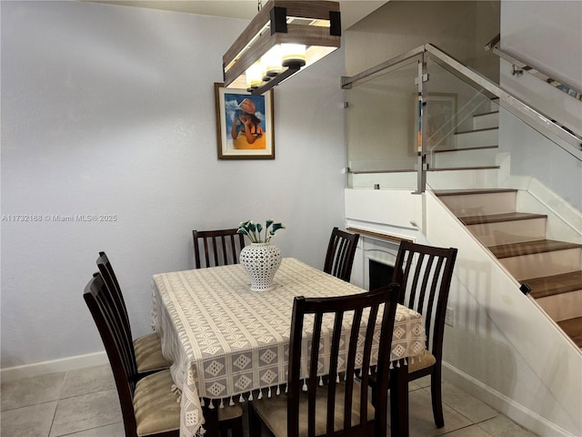 dining space with light tile patterned floors