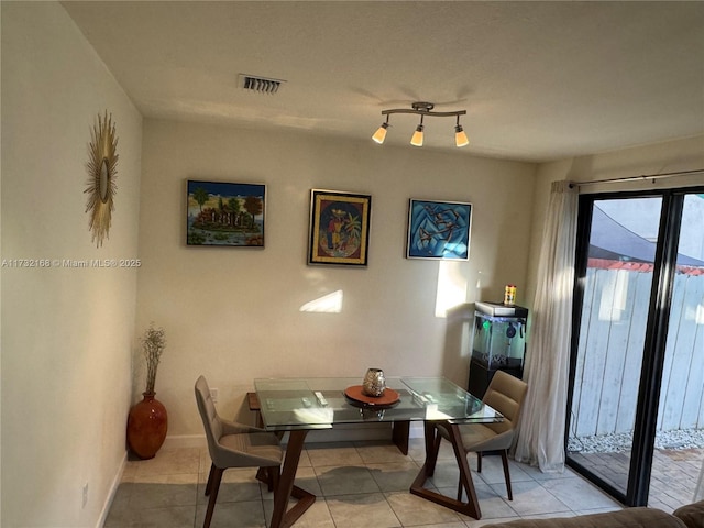 view of tiled dining room