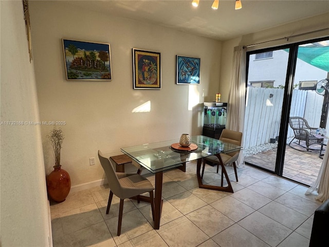 dining room with light tile patterned flooring