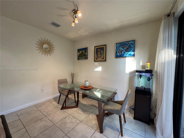 dining room with light tile patterned floors