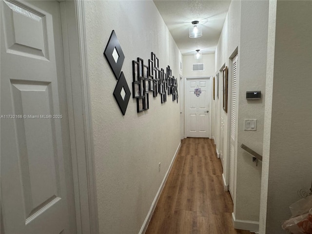 hallway featuring hardwood / wood-style flooring