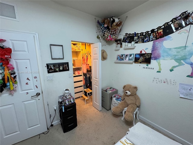 bedroom featuring light colored carpet