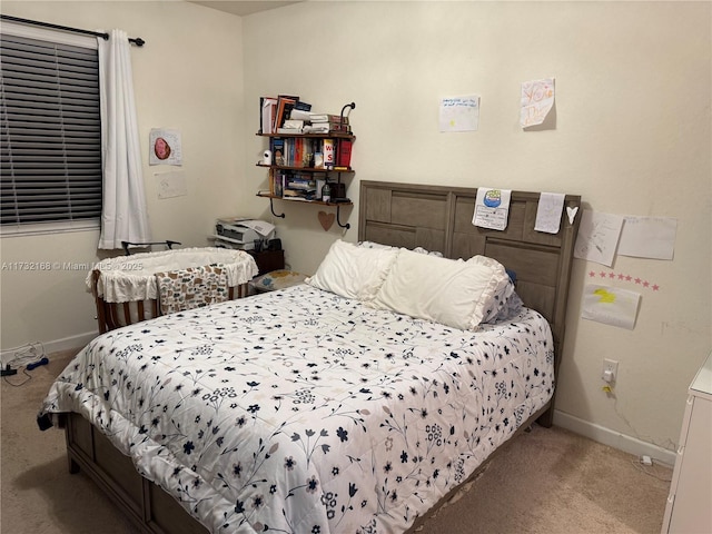 bedroom featuring light colored carpet