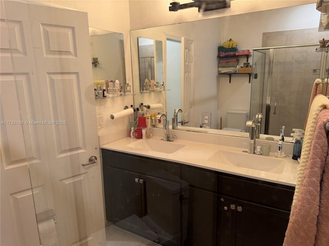 bathroom featuring vanity, toilet, and walk in shower